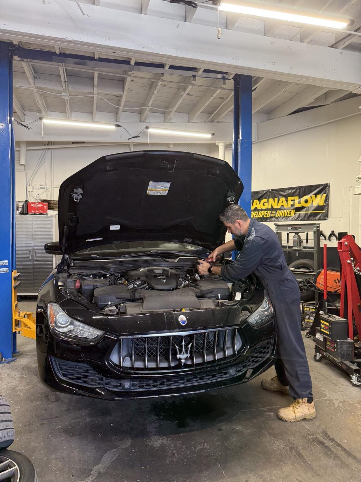 Bass inspecting a vehicle at Target Auto Repair